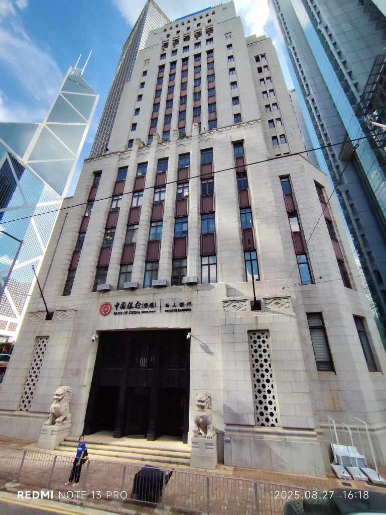 A central bank building pictured as retail digital currency pilots reach real shops and payment terminals.